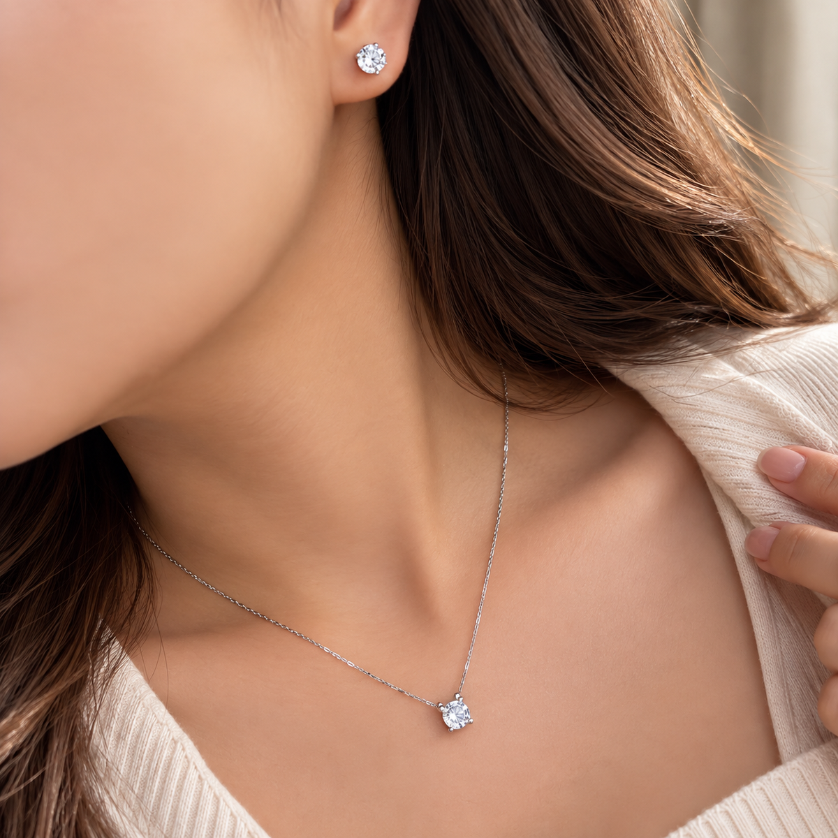 Soulia round zircon earrings and necklace worn close up